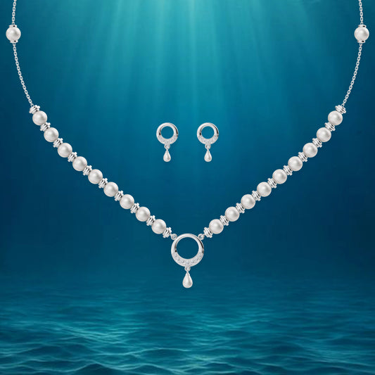 Artistic rendering of a silver halo jewelry set floating in a deep blue underwater scene with shimmering light