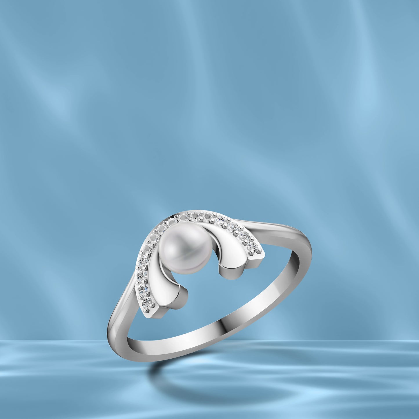 Silver Pearl Arch Ring Displayed Against a Wavy Light Blue Silk Background