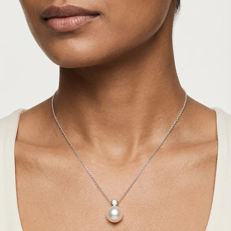 Women Wearing Silver Pearl Earrings