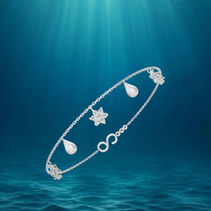 Elegant Silver Pearl Bracelet Featuring An Infinity Symbol Design Intertwined With Delicate White Pearl Jewellery.
