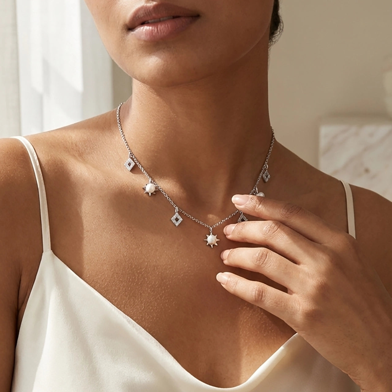 Radiance freshwater pearl charms necklace close-up
