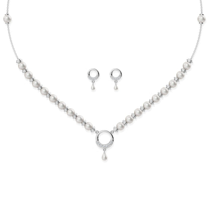 Minimalist silver circle pendant necklace with pearl strand details and matching circular stud earrings on white background