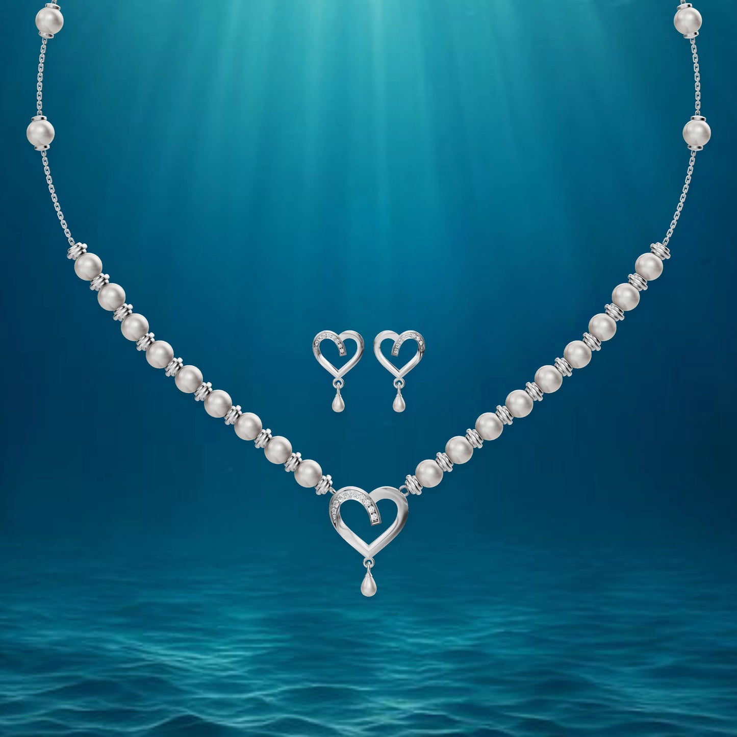 Silver heart jewelry set displayed against a deep blue, ethereal underwater-themed background