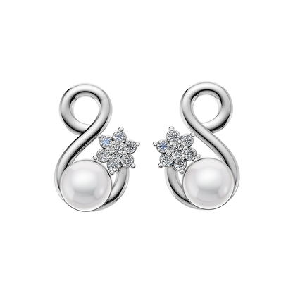 This image displays a pair of elegant Radiance Pearl Earrings. The earrings feature a sophisticated design, with each earring consisting of a large, lustrous pearl encircled by intricate, sparkling diamond accents.