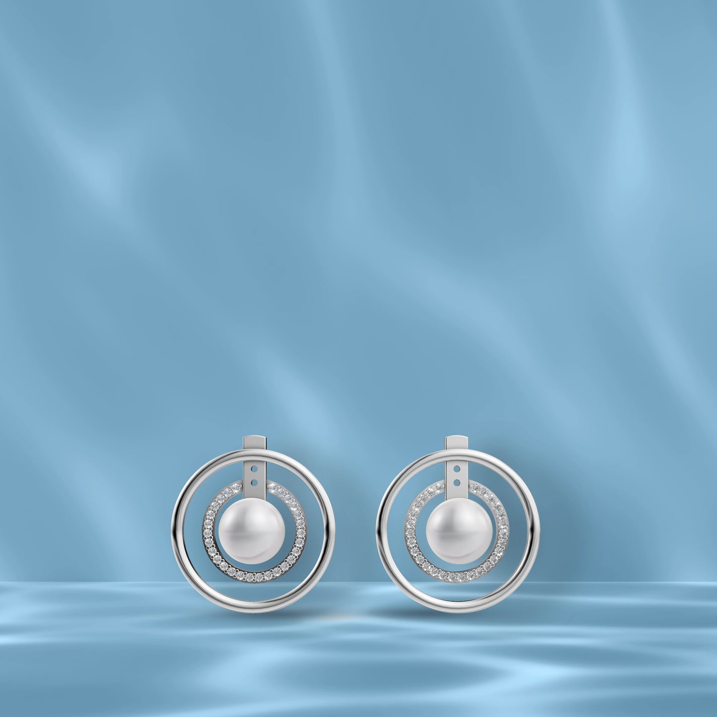 High-Quality Freshwater Pearl Earrings In Silver Displayed On A Blue Silk Backdrop Highlighting Original Pearl Earrings.