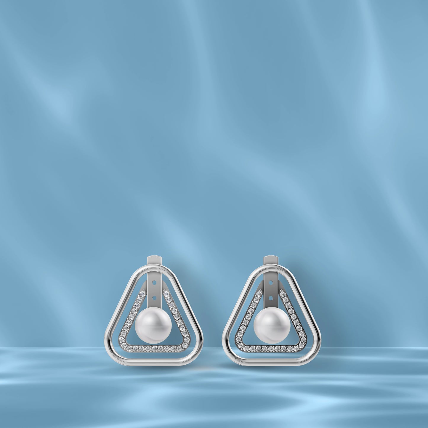 High-Quality Freshwater Pearl Earrings Displayed Against A Blue Silk Backdrop Highlighting Original Pearl Earrings.