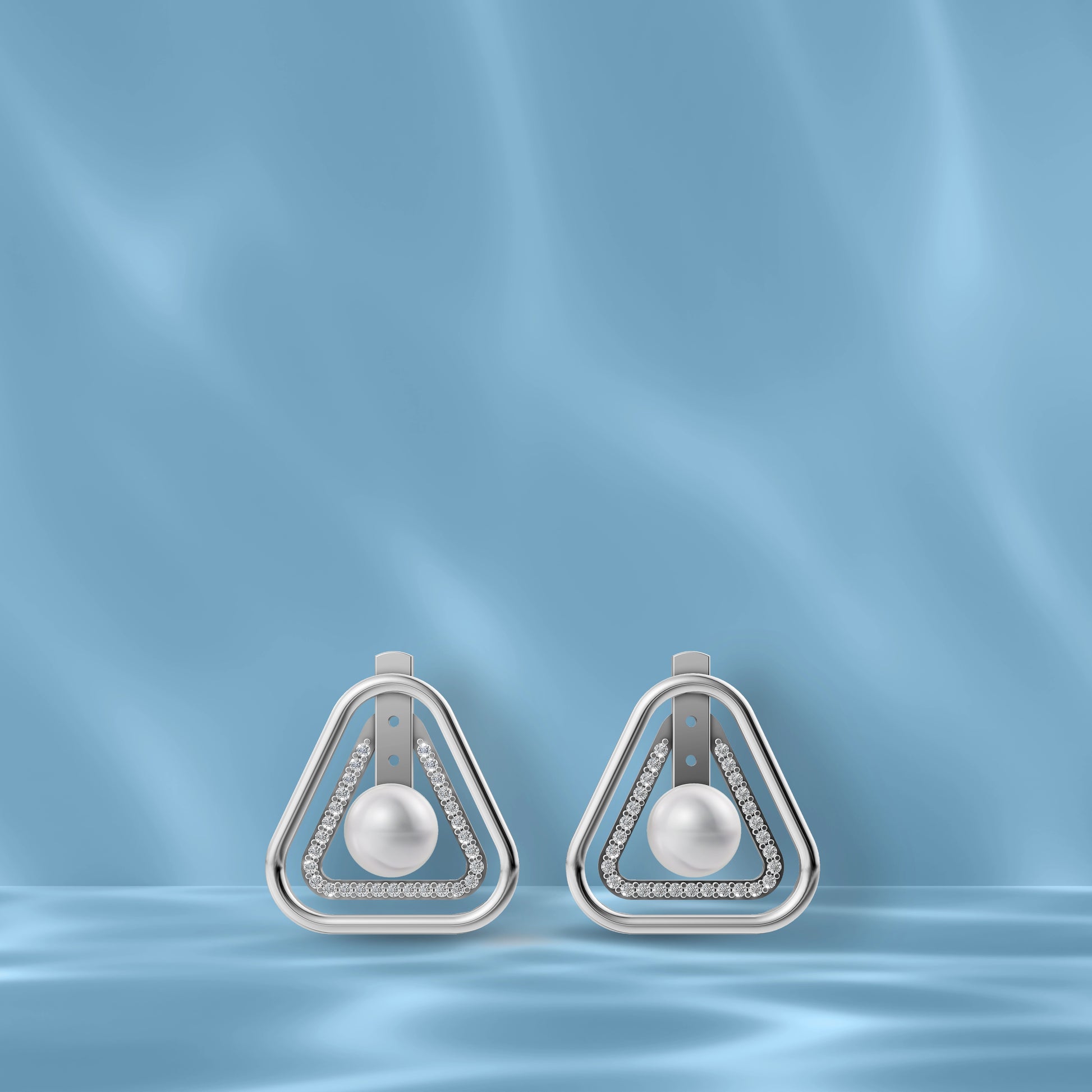 High-Quality Freshwater Pearl Earrings Displayed Against A Blue Silk Backdrop Highlighting Original Pearl Earrings.