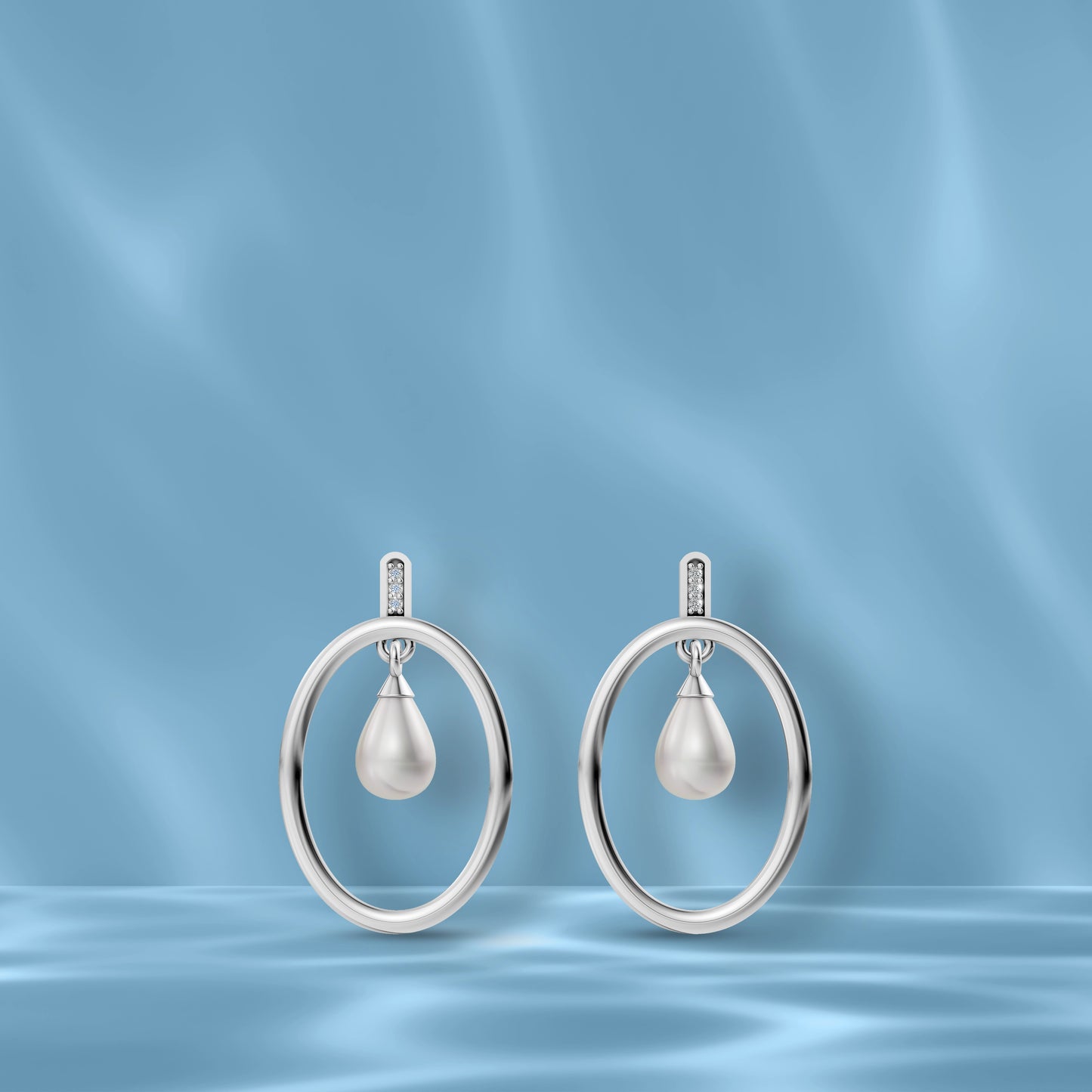 High-Quality Freshwater Pearl Earrings Displayed Against A Blue Silk Backdrop Highlighting Original Pearl Earrings.