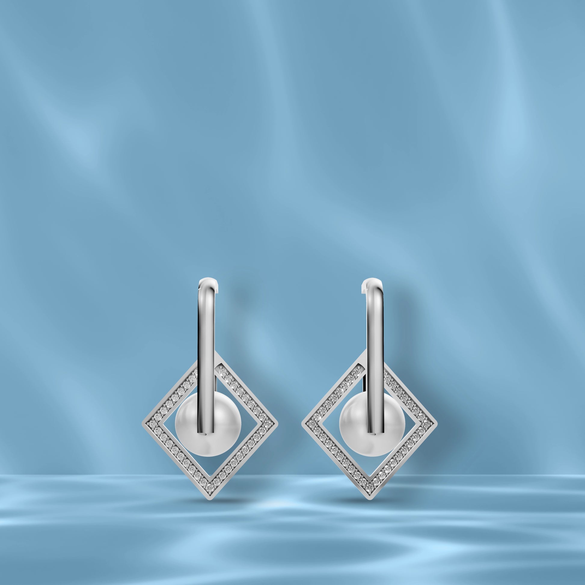 Premium Freshwater Pearl Earrings Showcased On A Blue Silk Background Highlighting Original Pearl Earrings Quality.