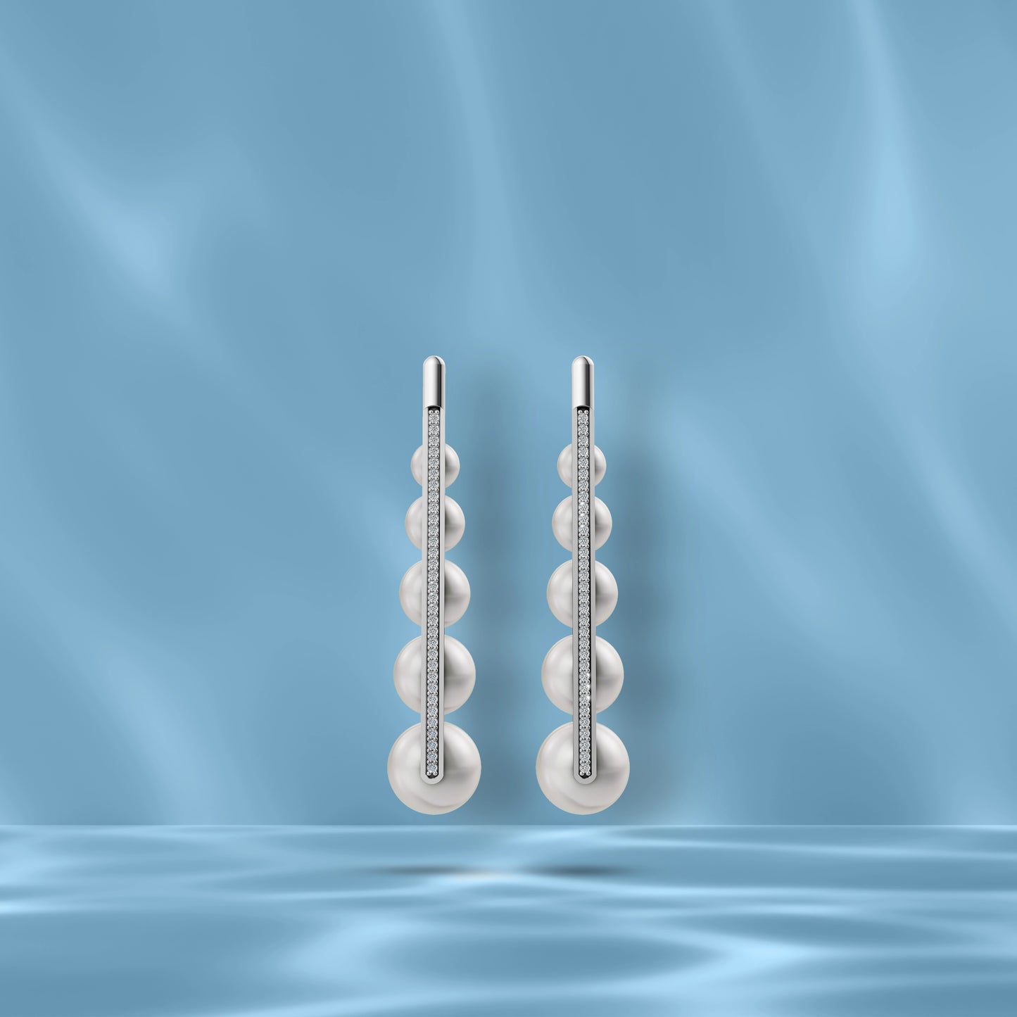 High-Quality Freshwater Pearl Earrings Displayed Against A Blue Silk Backdrop Highlighting Original Pearl Earrings.