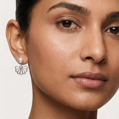 A Model Showcasing Pearl Stud Earrings In A Minimalist Silver Pearl Jewellery Style For Daily Wear.