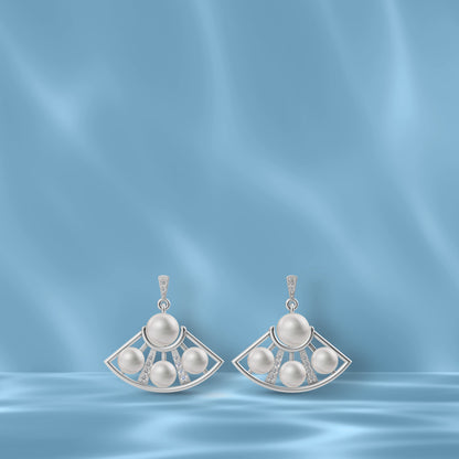 Beautifully crafted Freshwater Pearl Earrings in silver showcasing Original Pearl Earrings on a blue silk background.
