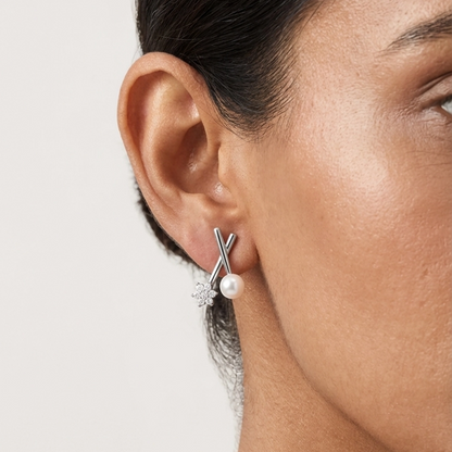 Modern X-Cross small pearl stud earrings close-up