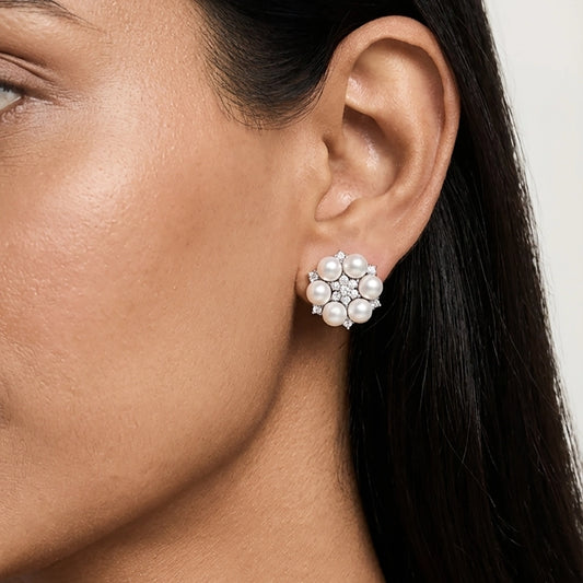 Close-up of a woman wearing silver pearl earrings 