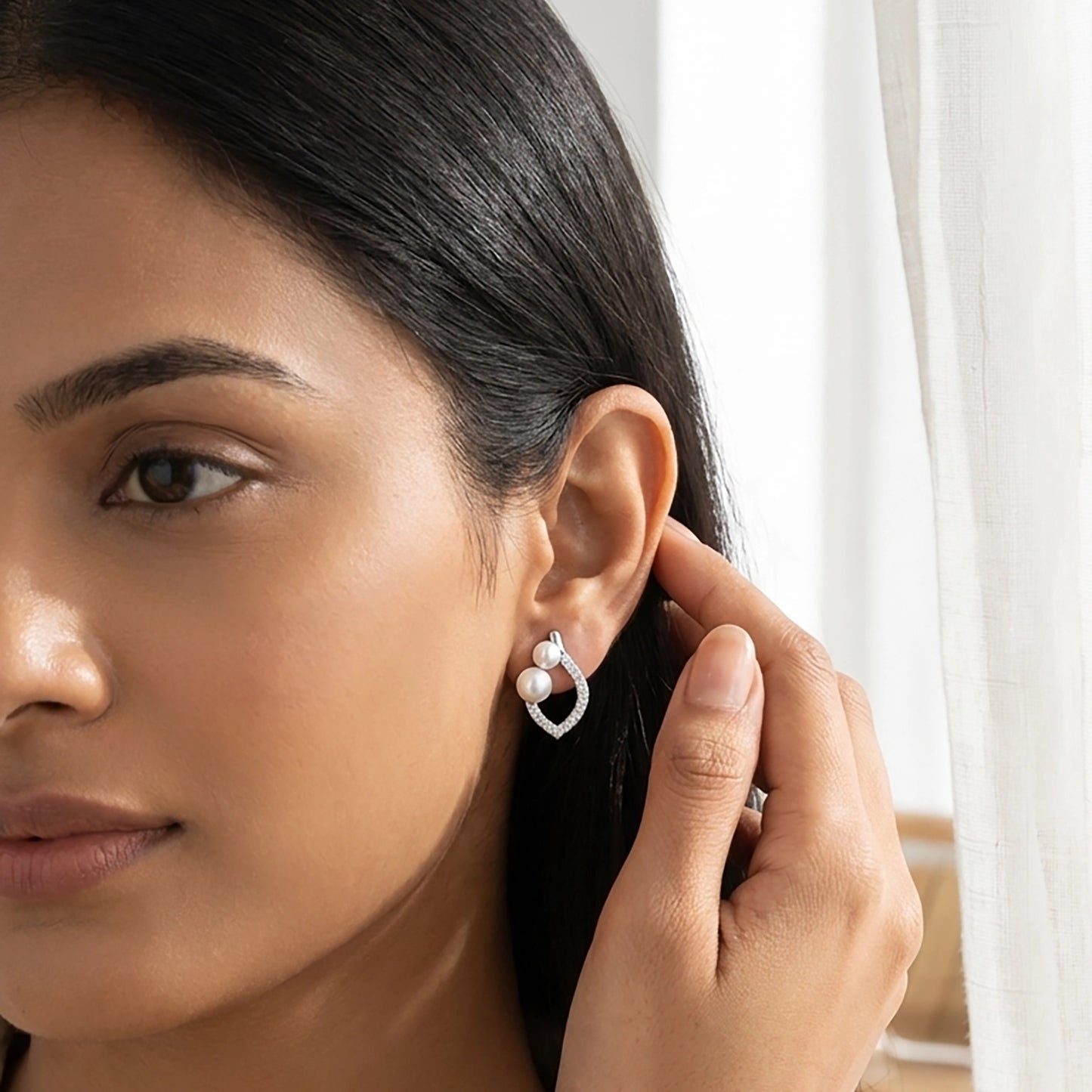 Radiance pearl earrings close-up silver design