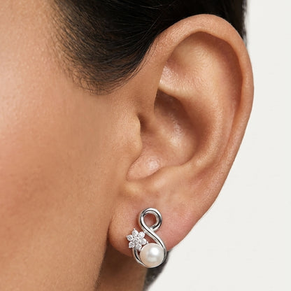 Infinity pearl earrings close-up silver finish