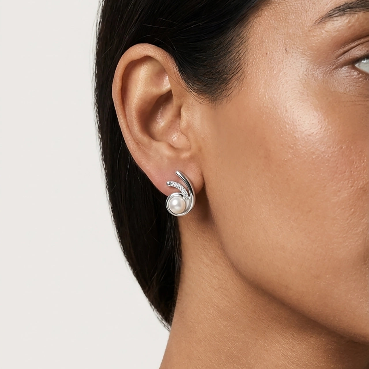 Orbit pearl silver stud earrings close-up