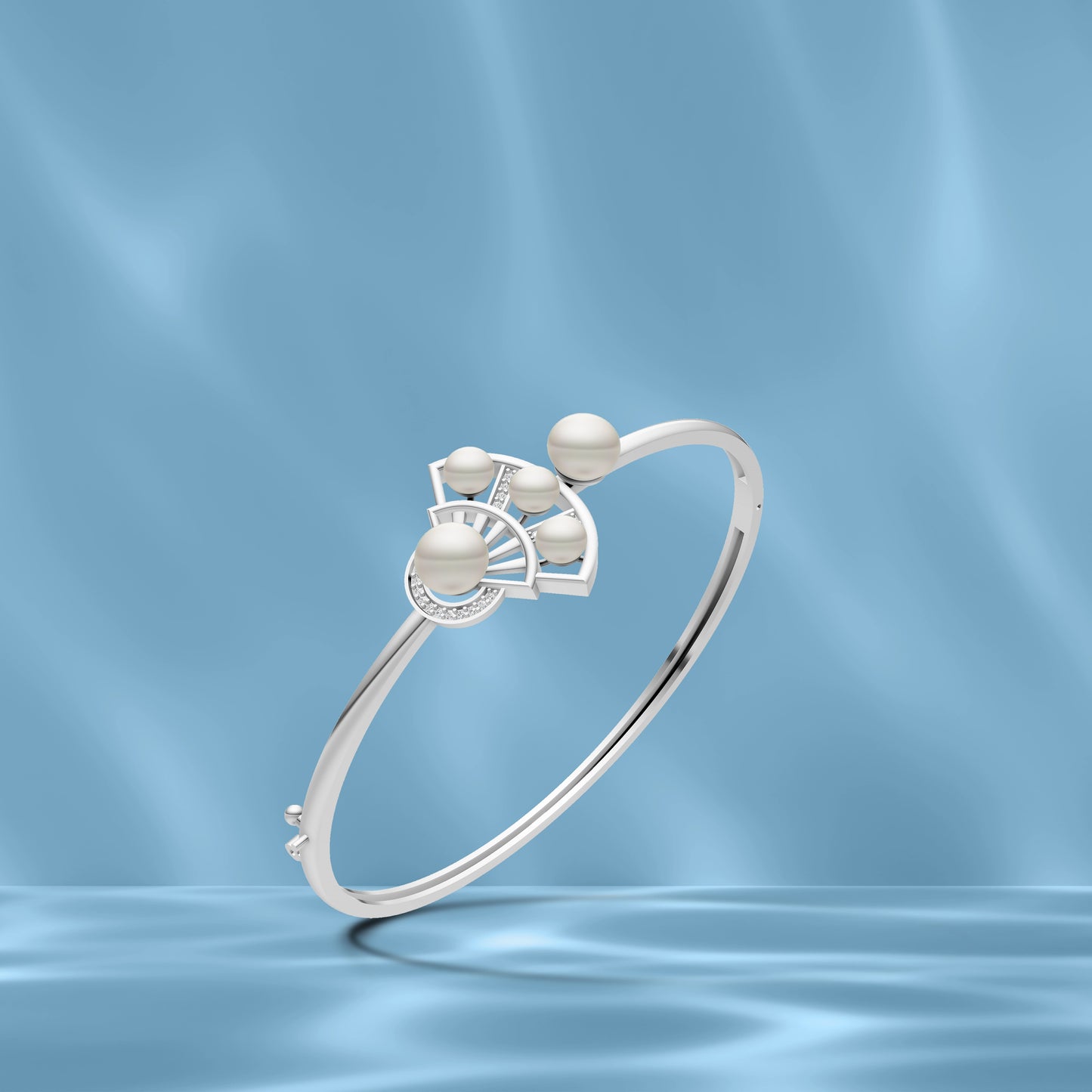 Silver pearl fan kada displayed against a soft, shimmering light blue water-themed background.