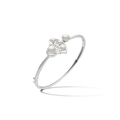 Elegant silver kada featuring a double fan motif set with multiple white pearls on a plain white background