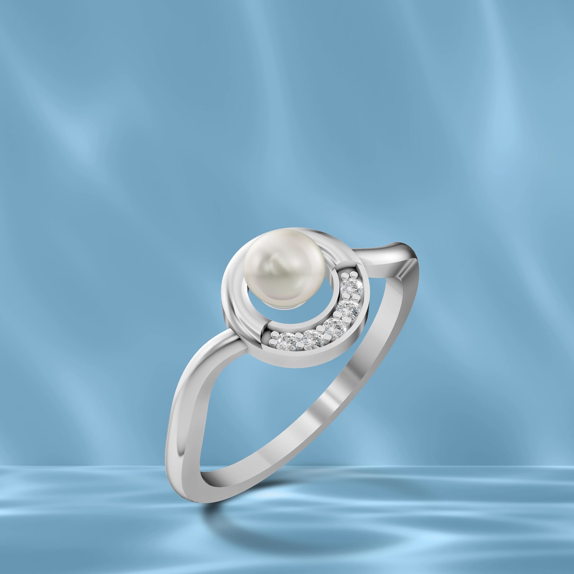 Silver Pearl Moon Ring displayed against a Wavy Light Blue Silk Background