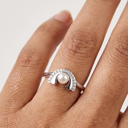Silver Pearl Arch Ring With Diamond Detailing Worn On a Hand