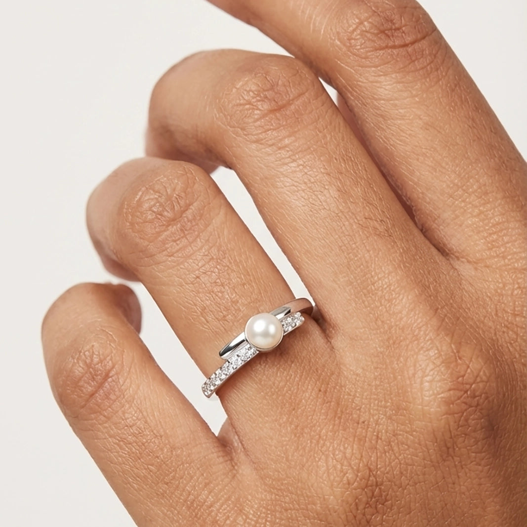 A Model Wearing A Minimalist Pearl Ring For Women Showcasing A Delicate Silver Pearl Ring For Everyday Sophistication.